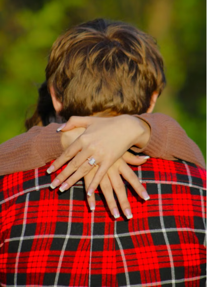 Newlyweds displaying wedding rings